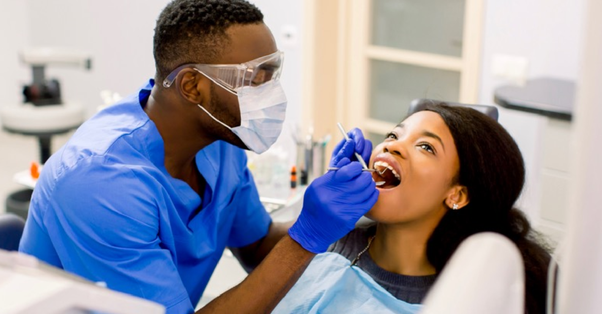 Image from the Metro City Q depicting a dentist and patient in a dental office