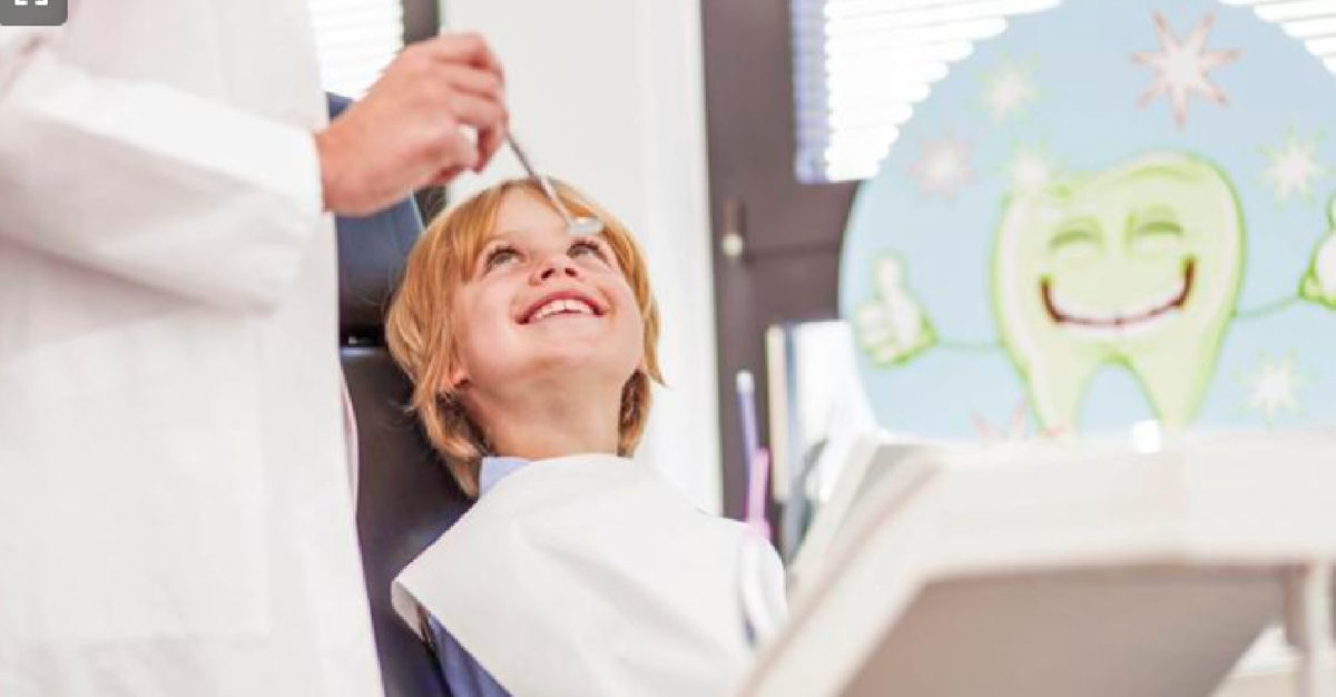 picture of child in dental chair from Statesville Record & Landmark article about NCOHC